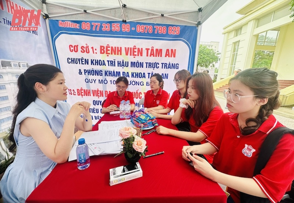 A group of people sitting around a table

Description automatically generated